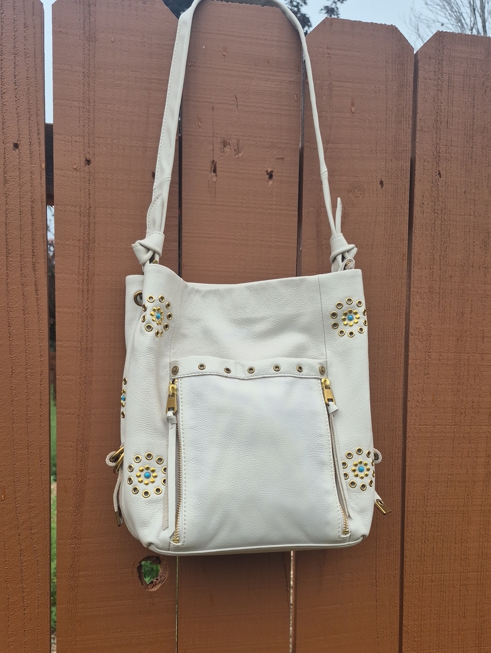 The Sak Ojai White Shoulder Bag with Gold Studs and Turquoise Accents